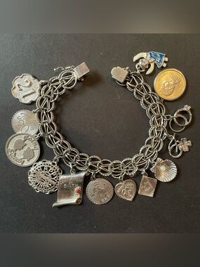 Vintage Sterling silver Charm Bracelet with 13 Assorted Charms.